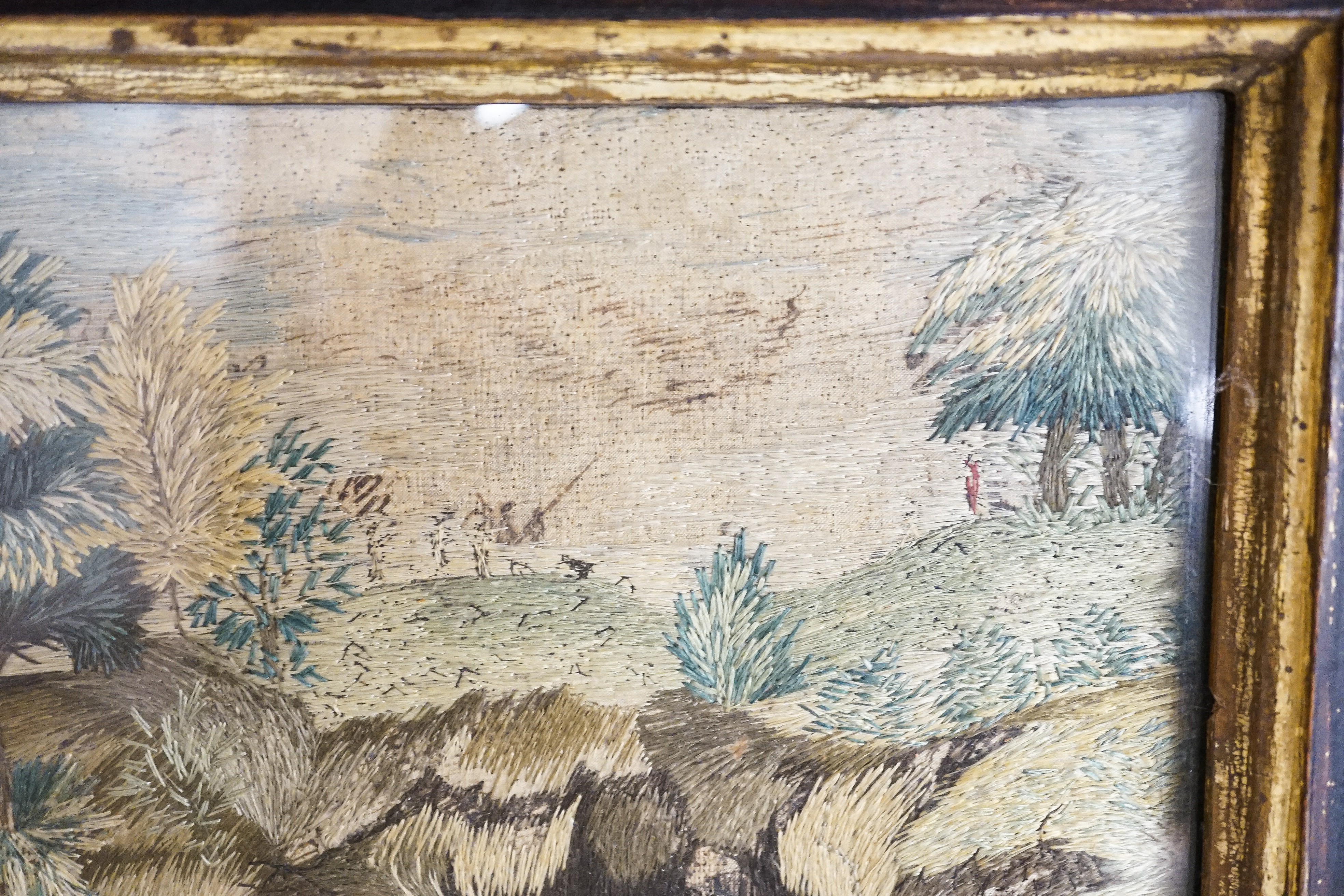 A pair of 18th century wool and silkwork pictures in ebonised frames, 26 cms high x 22 cms wide.